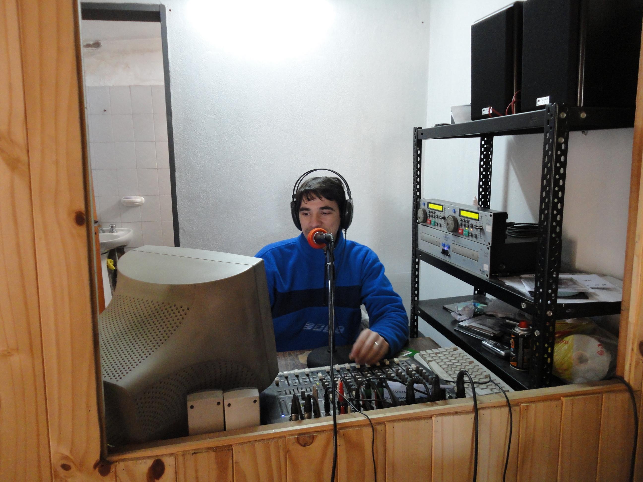 A Projects Abroad intern in the recording booth at his placement An intern records at our journalism placement in Argentina